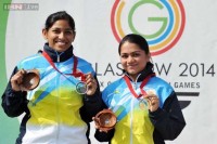 Indias Jitu Rai R and Gurpal Singh celebrate after winning gold and silver medals respectively in the 50m pistol