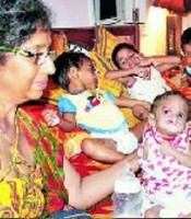 Madhu Tugnait extends her hands towards Destitute Children