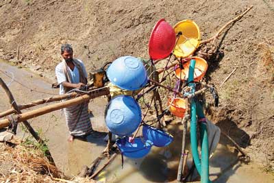 Farmer designs water mill for electricity