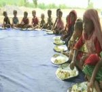 Anganwadi workers feeding tribal people